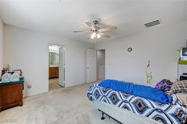 8783 Halcon Ave, Las Vegas, NV 89148 - bedroom featuring light colored carpet, a ceiling fan, connected bathroom, and visible vents
