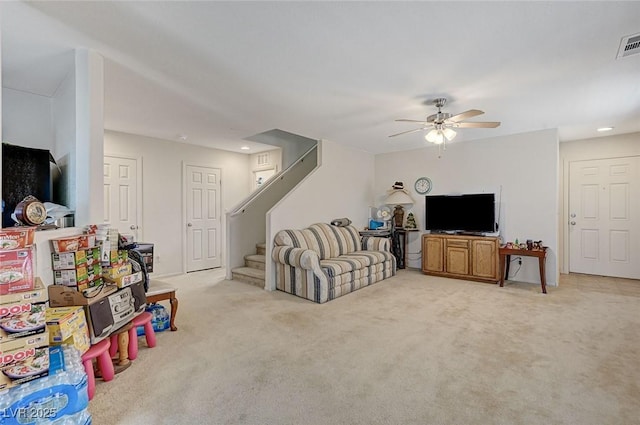 8783 Halcon Ave, Las Vegas, NV 89148 - living room featuring stairway, a ceiling fan, light colored carpet, visible vents, and recessed lighting