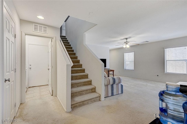 8783 Halcon Ave, Las Vegas, NV 89148 - stairs with carpet floors, visible vents, baseboards, and ceiling fan