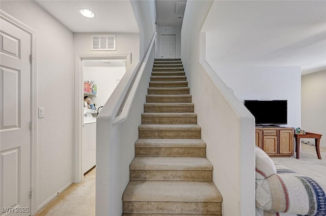 8783 Halcon Ave, Las Vegas, NV 89148 - stairs with carpet floors, washer / clothes dryer, visible vents, and baseboards