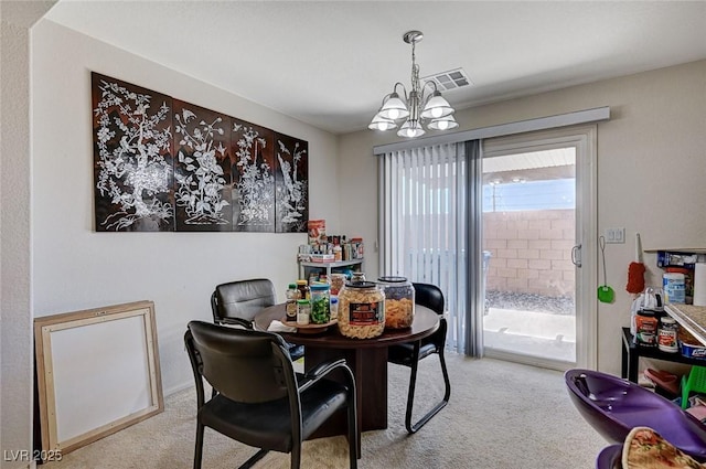 8783 Halcon Ave, Las Vegas, NV 89148 - carpeted dining room featuring a chandelier and visible vents