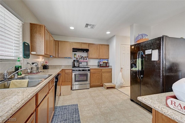 8783 Halcon Ave, Las Vegas, NV 89148 - kitchen featuring a sink, visible vents, light countertops, under cabinet range hood, and black appliances
