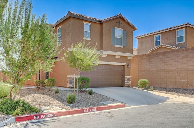 8783 Halcon Ave, Las Vegas, NV 89148 - view of front of property featuring stucco siding, fence, driveway, and a garage