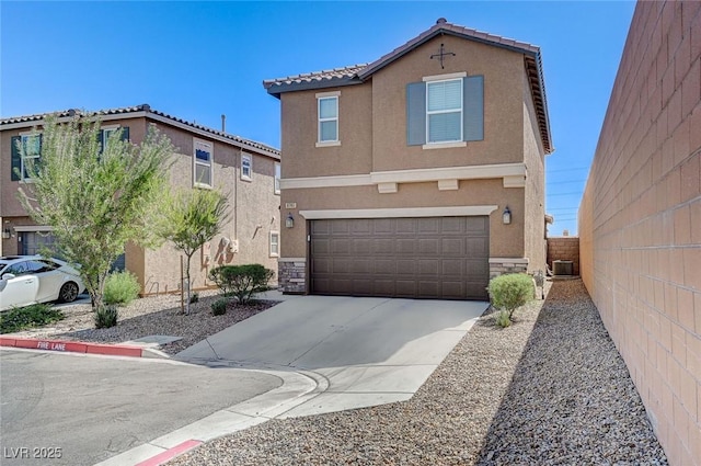 8783 Halcon Ave, Las Vegas, NV 89148 - view of front of home with stucco siding, an attached garage, fence, and driveway