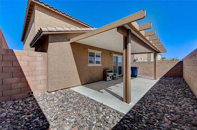 8783 Halcon Ave, Las Vegas, NV 89148 - exterior space with a fenced backyard, a patio, and stucco siding