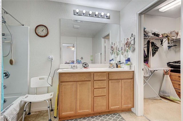 8783 Halcon Ave, Las Vegas, NV 89148 - bathroom featuring tile patterned flooring, a sink,  shower combination, and double vanity