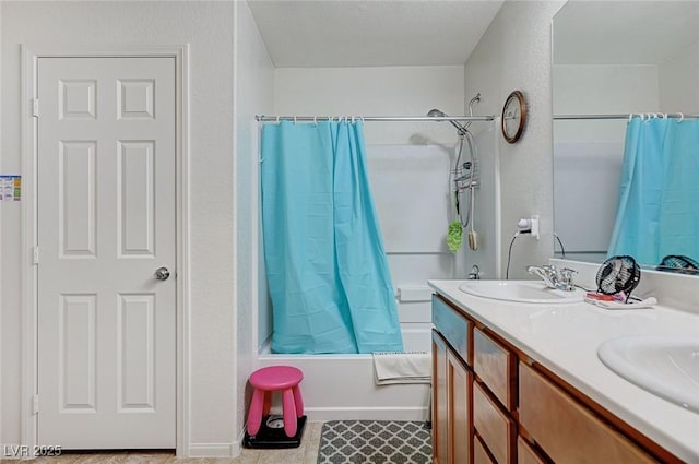 8783 Halcon Ave, Las Vegas, NV 89148 - full bathroom featuring double vanity, shower / tub combo with curtain, tile patterned floors, and a sink