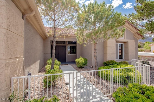10709 Hunters Woods Pl, Las Vegas, NV 89134 - property entrance featuring fence, stucco siding, a tile roof, and a gate