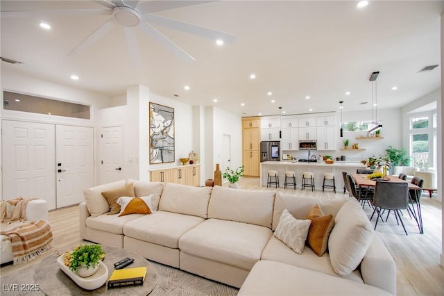 10709 Hunters Woods Pl, Las Vegas, NV 89134 - living room featuring light wood-style flooring, a ceiling fan, and recessed lighting