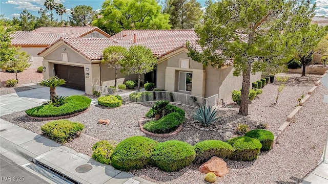 10709 Hunters Woods Pl, Las Vegas, NV 89134 - view of front of property featuring stucco siding, an attached garage, a tile roof, and concrete driveway