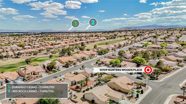 10709 Hunters Woods Pl, Las Vegas, NV 89134 - aerial view of residential area featuring a golf club and a mountainous background