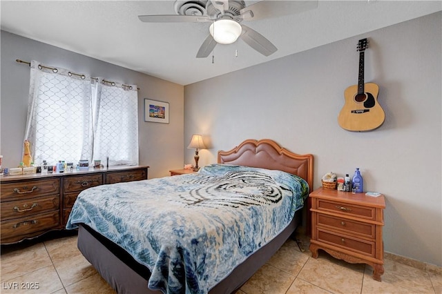 bedroom featuring light tile patterned floors and ceiling fan