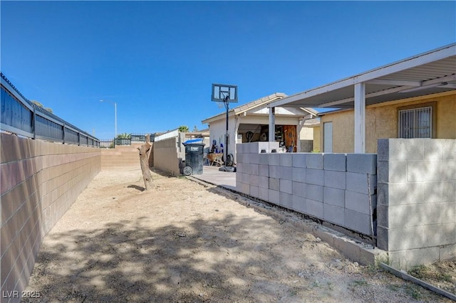 view of home's exterior featuring fence