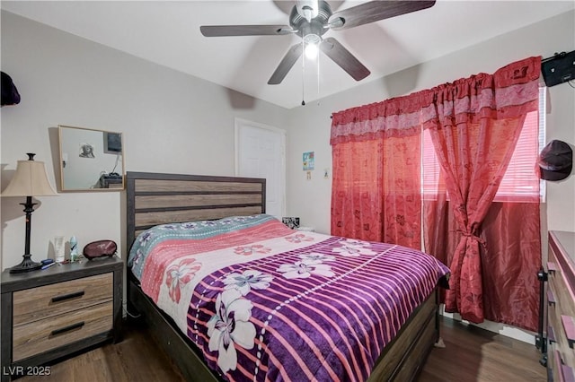 bedroom with wood finished floors and a ceiling fan