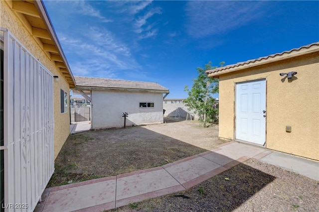 view of yard featuring a patio and fence