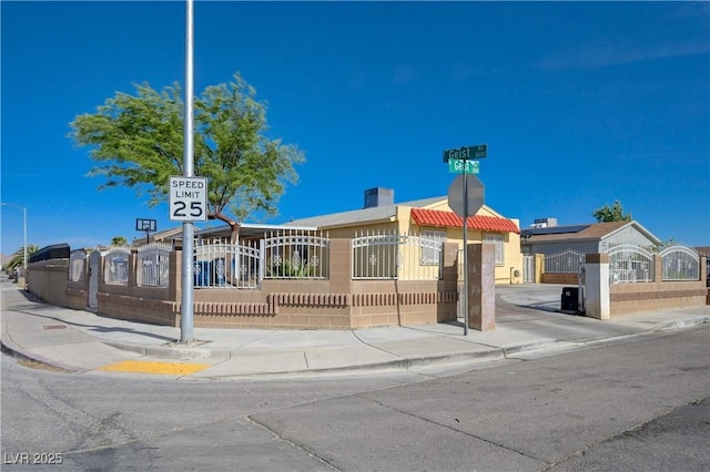 view of building exterior featuring a fenced front yard