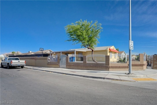 single story home with a fenced front yard