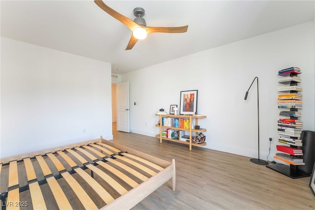 7307 Grace Estate Ave, Las Vegas, NV 89113 - bedroom featuring baseboards, light wood-style floors, and ceiling fan