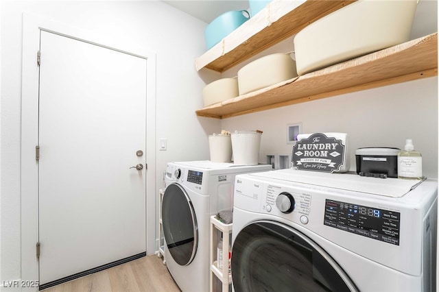 7307 Grace Estate Ave, Las Vegas, NV 89113 - clothes washing area featuring light wood-type flooring, washer and dryer, and laundry area