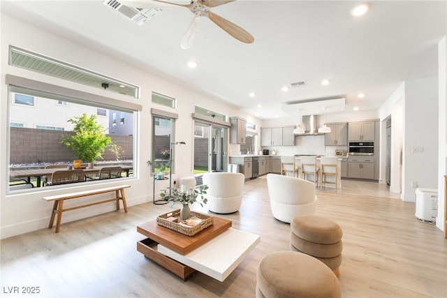 7307 Grace Estate Ave, Las Vegas, NV 89113 - living room with light wood-style flooring, visible vents, recessed lighting, and a ceiling fan