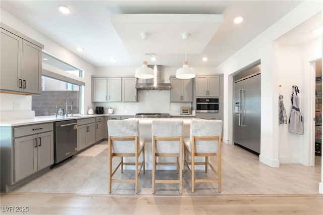 7307 Grace Estate Ave, Las Vegas, NV 89113 - kitchen with gray cabinets, wall chimney exhaust hood, appliances with stainless steel finishes, and a sink