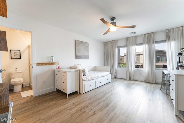 7307 Grace Estate Ave, Las Vegas, NV 89113 - bedroom featuring light wood-style flooring, baseboards, visible vents, a ceiling fan, and ensuite bath