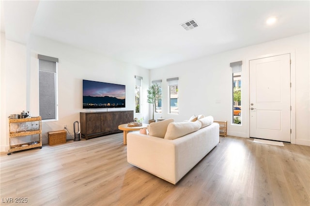 7307 Grace Estate Ave, Las Vegas, NV 89113 - living room featuring visible vents and light wood-style flooring