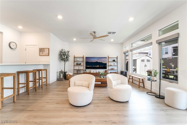 7307 Grace Estate Ave, Las Vegas, NV 89113 - living room featuring a ceiling fan, wood finished floors, visible vents, and recessed lighting