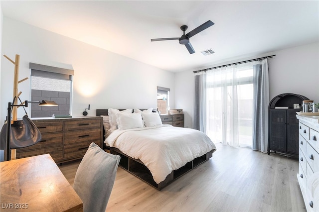 7307 Grace Estate Ave, Las Vegas, NV 89113 - bedroom with a ceiling fan, multiple windows, visible vents, and light wood-type flooring