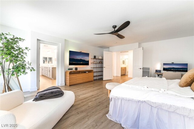 7307 Grace Estate Ave, Las Vegas, NV 89113 - bedroom with light wood-type flooring, ensuite bath, a ceiling fan, and baseboards