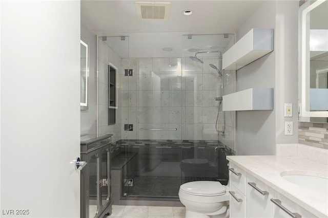 bathroom featuring recessed lighting, a shower stall, vanity, toilet, and visible vents