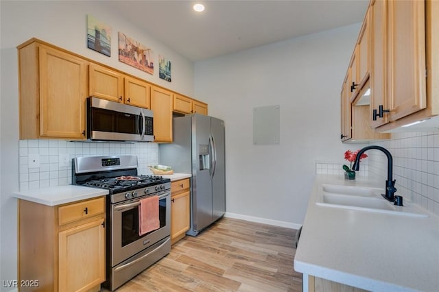 2305 W Horizon Ridge Pkwy Unit 3713, Henderson, NV 89052 - kitchen with light countertops, tasteful backsplash, appliances with stainless steel finishes, and light brown cabinetry