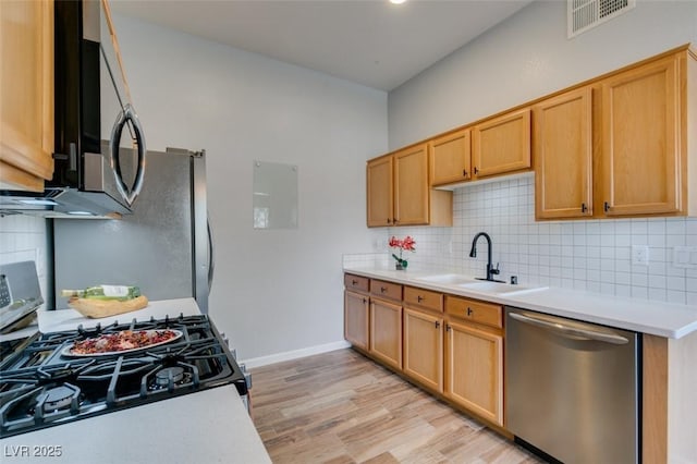 2305 W Horizon Ridge Pkwy Unit 3713, Henderson, NV 89052 - kitchen with a sink, visible vents, backsplash, light countertops, and appliances with stainless steel finishes