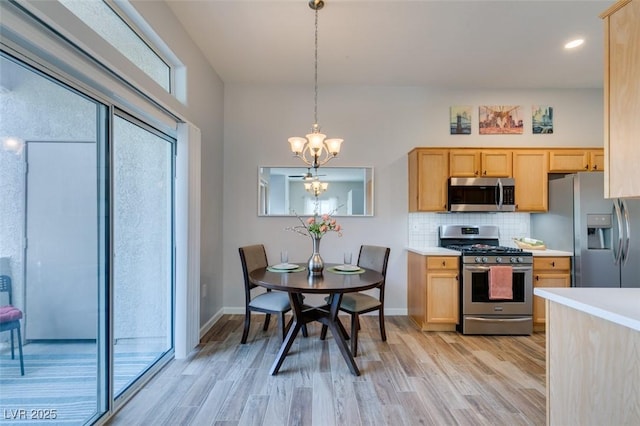 2305 W Horizon Ridge Pkwy Unit 3713, Henderson, NV 89052 - kitchen featuring a chandelier, stainless steel appliances, light countertops, and light wood-style flooring
