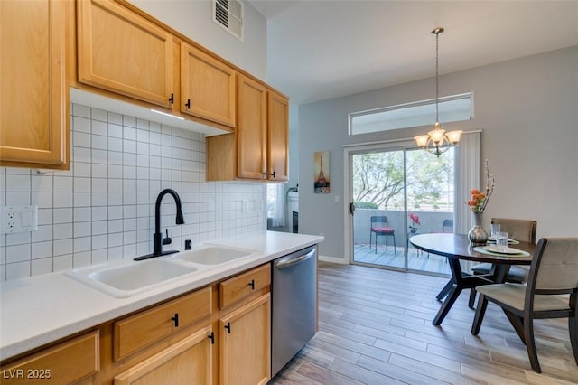 2305 W Horizon Ridge Pkwy Unit 3713, Henderson, NV 89052 - kitchen with light countertops, dishwasher, a sink, decorative backsplash, and a chandelier