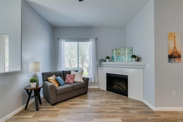 2305 W Horizon Ridge Pkwy Unit 3713, Henderson, NV 89052 - living room featuring a fireplace, light wood-type flooring, and baseboards
