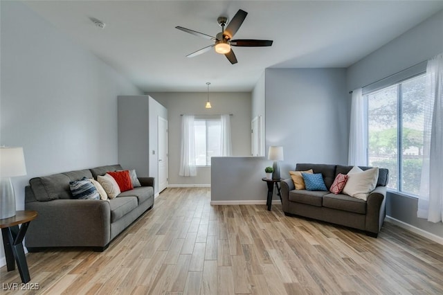 2305 W Horizon Ridge Pkwy Unit 3713, Henderson, NV 89052 - living room with light wood-type flooring, baseboards, a wealth of natural light, and ceiling fan
