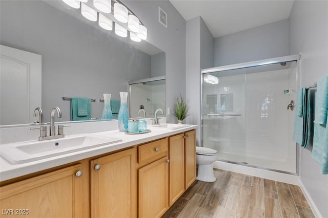 2305 W Horizon Ridge Pkwy Unit 3713, Henderson, NV 89052 - full bathroom with wood finished floors, a sink, double vanity, and a stall shower