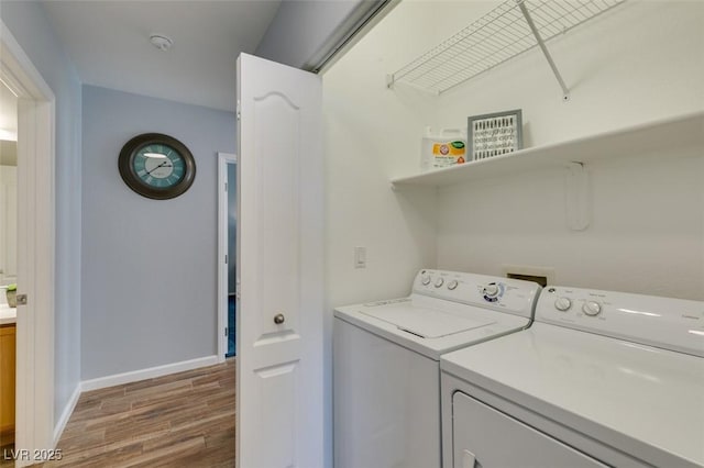 2305 W Horizon Ridge Pkwy Unit 3713, Henderson, NV 89052 - washroom with separate washer and dryer, baseboards, wood finished floors, and laundry area