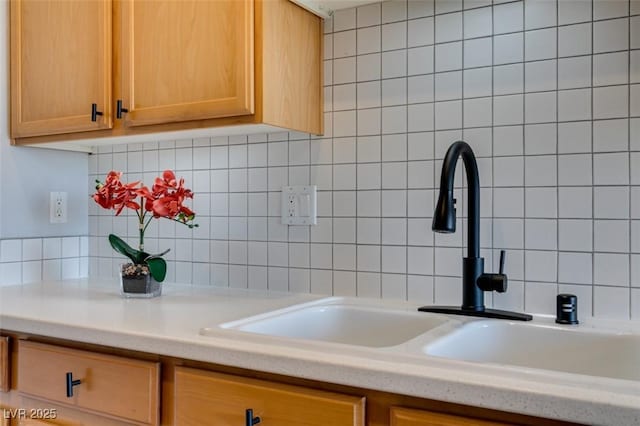 2305 W Horizon Ridge Pkwy Unit 3713, Henderson, NV 89052 - kitchen featuring light countertops, backsplash, light brown cabinets, and a sink