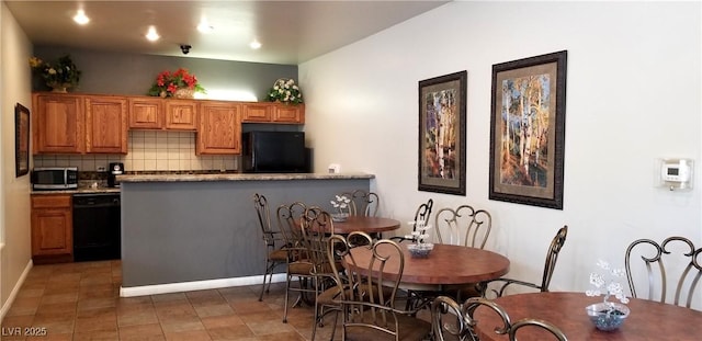 2305 W Horizon Ridge Pkwy Unit 3713, Henderson, NV 89052 - kitchen featuring brown cabinets, decorative backsplash, black appliances, tile patterned floors, and a peninsula