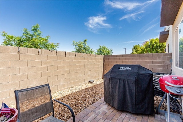 3208 Lumassina Way, Henderson, NV 89044 - view of patio / terrace with grilling area and fence