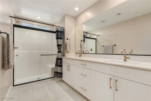 3208 Lumassina Way, Henderson, NV 89044 - full bathroom featuring double vanity, a sink, visible vents, and a stall shower