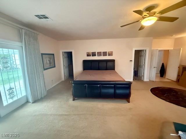 10561 Rancho Destino Rd, Las Vegas, NV 89183 - bedroom featuring visible vents, ceiling fan, and light carpet