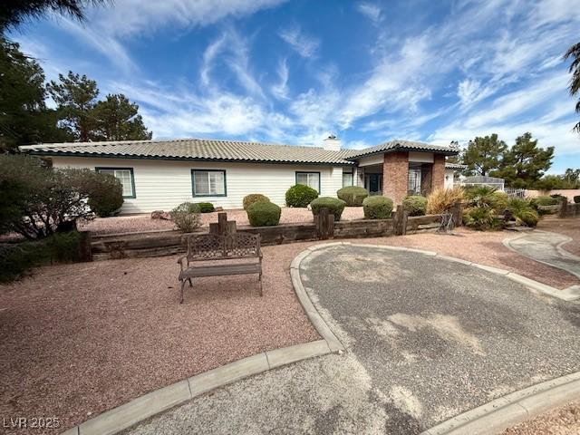10561 Rancho Destino Rd, Las Vegas, NV 89183 - ranch-style house featuring a chimney and a tile roof