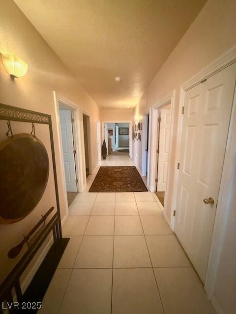 10561 Rancho Destino Rd, Las Vegas, NV 89183 - corridor with light tile patterned flooring