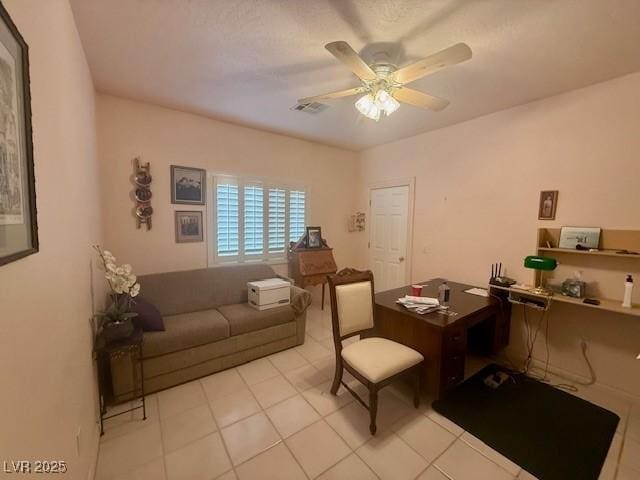 10561 Rancho Destino Rd, Las Vegas, NV 89183 - home office with visible vents, a ceiling fan, and light tile patterned flooring
