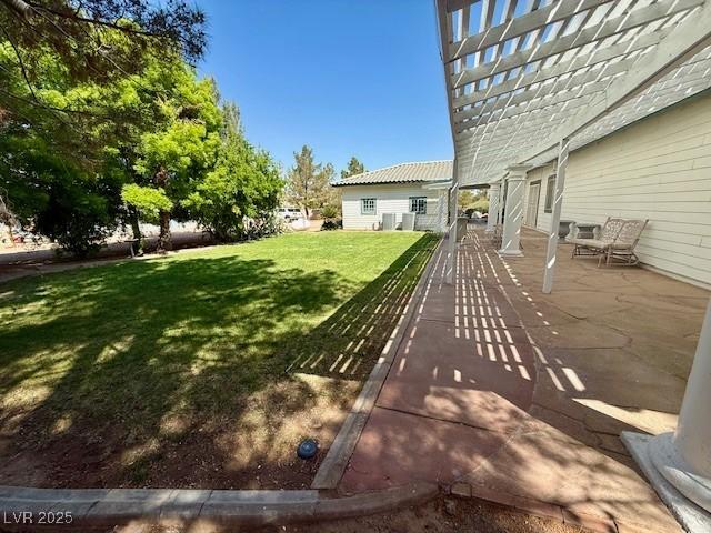 10561 Rancho Destino Rd, Las Vegas, NV 89183 - view of yard with a patio