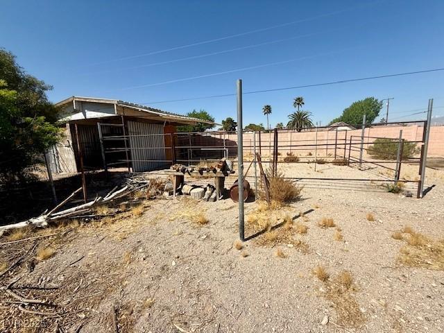 10561 Rancho Destino Rd, Las Vegas, NV 89183 - view of yard featuring an exterior structure and an outbuilding