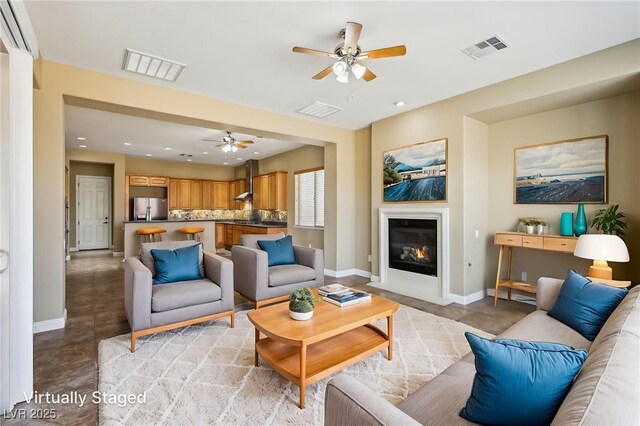 3904 Redbreast Ln, North Las Vegas, NV 89084 - living area featuring baseboards, a ceiling fan, visible vents, and concrete floors